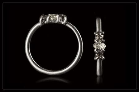 0.54 ct. Natural Whitish and Black rough diamonds in 14K white gold ring