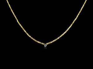 <strong>1.13 ct.</strong> Natural Rough diamond & 20.09 ct. Yellow Facetted diamonds in a collier